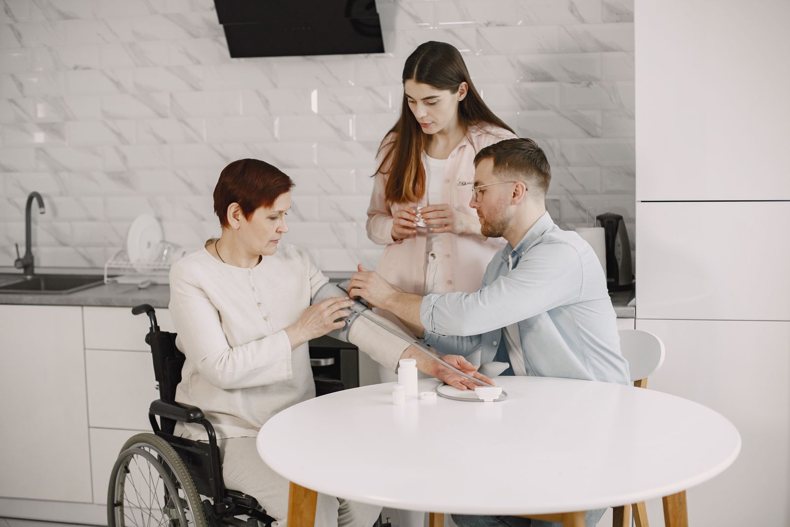 A family embracing an elderly loved one at home